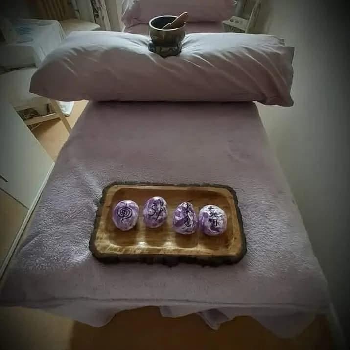 Reiki treatment room with symbol stones on the couch
